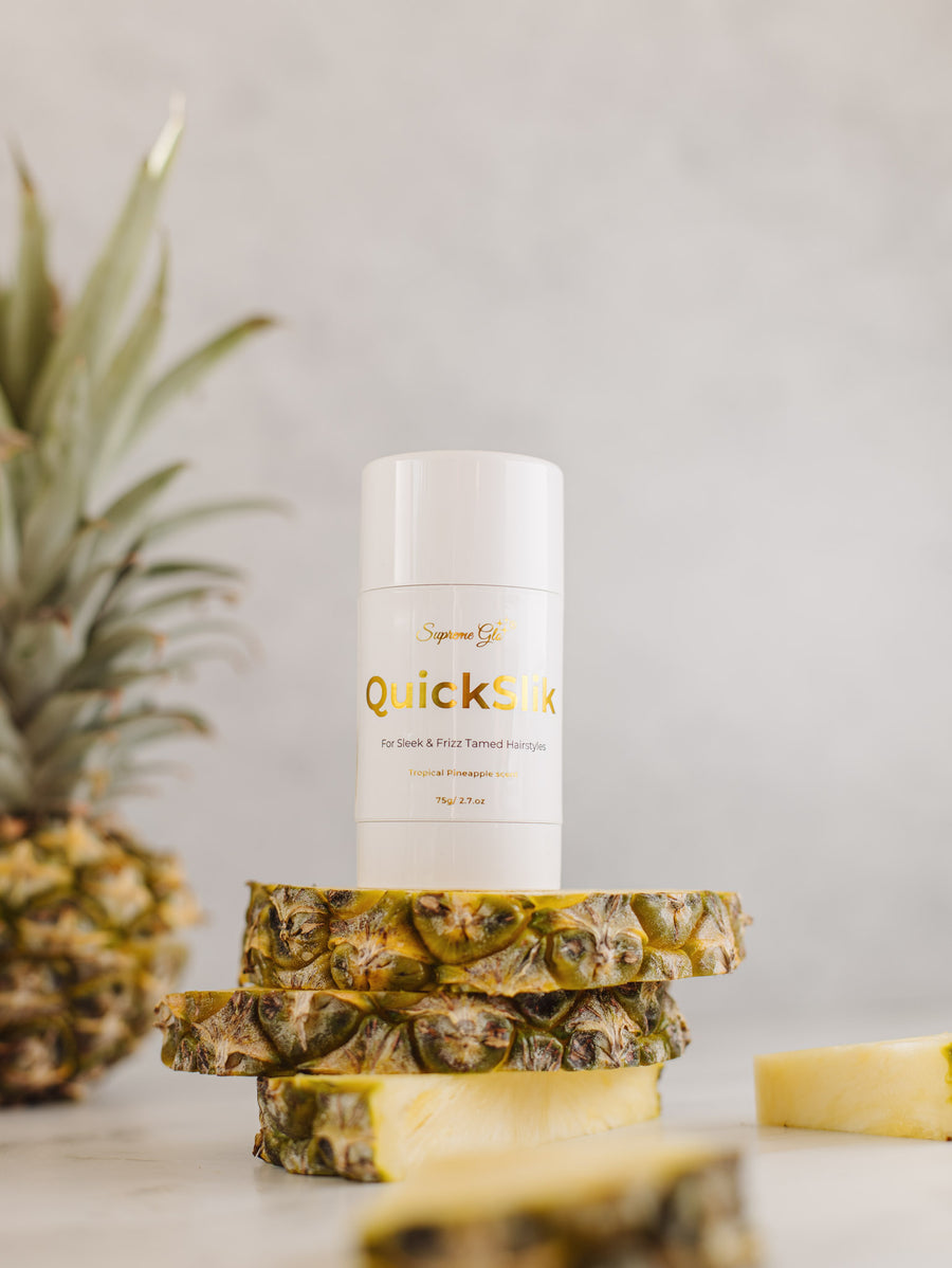 hair balm bottle on fresh cut pineapple